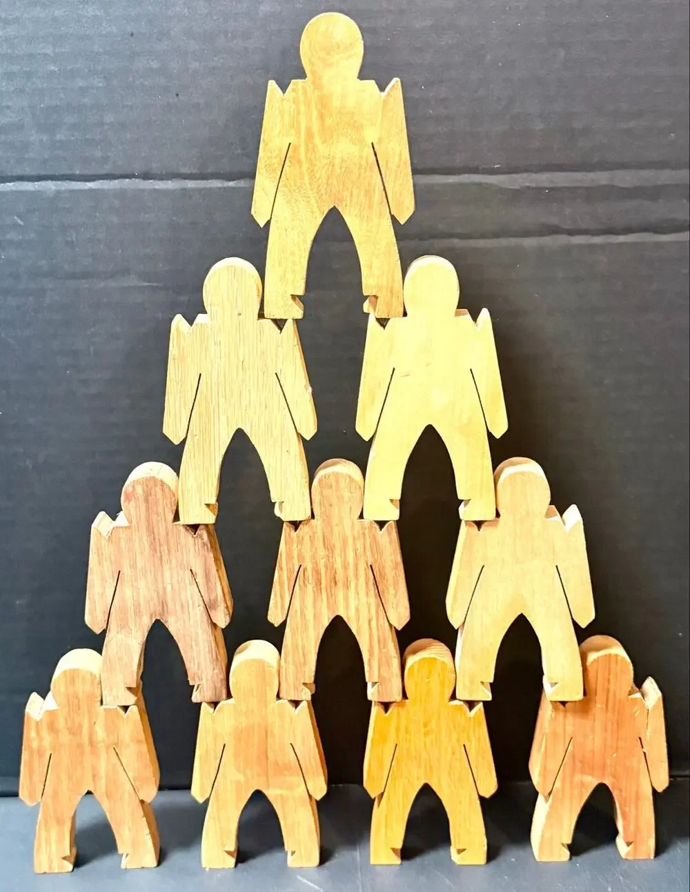 Wooden Stacking Dudes interlocking human shaped made of multiple woods